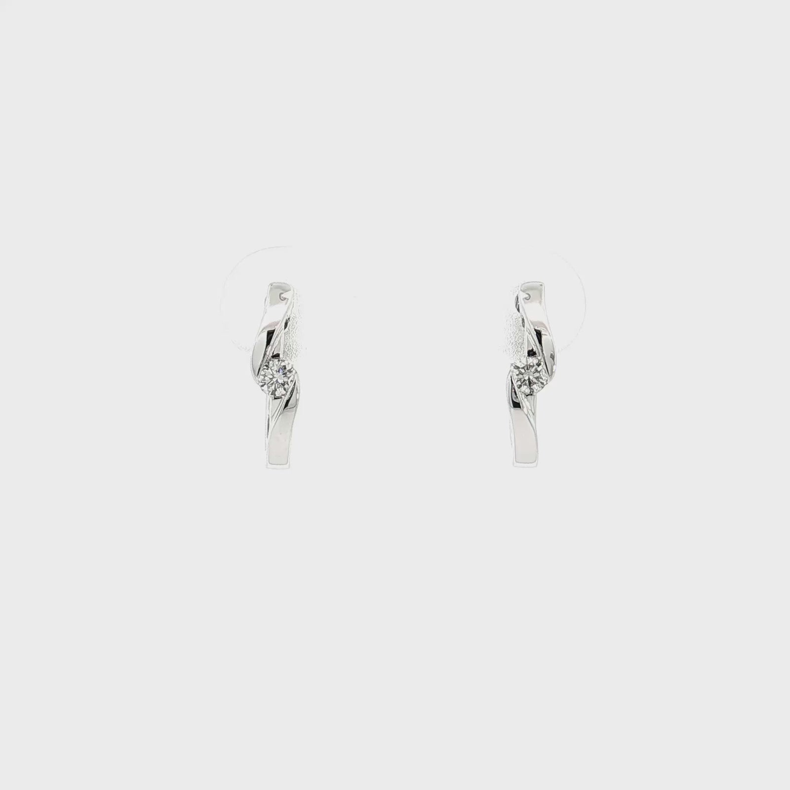 14K White Gold 0.13cttw. Diamond Twist Huggie Earrings