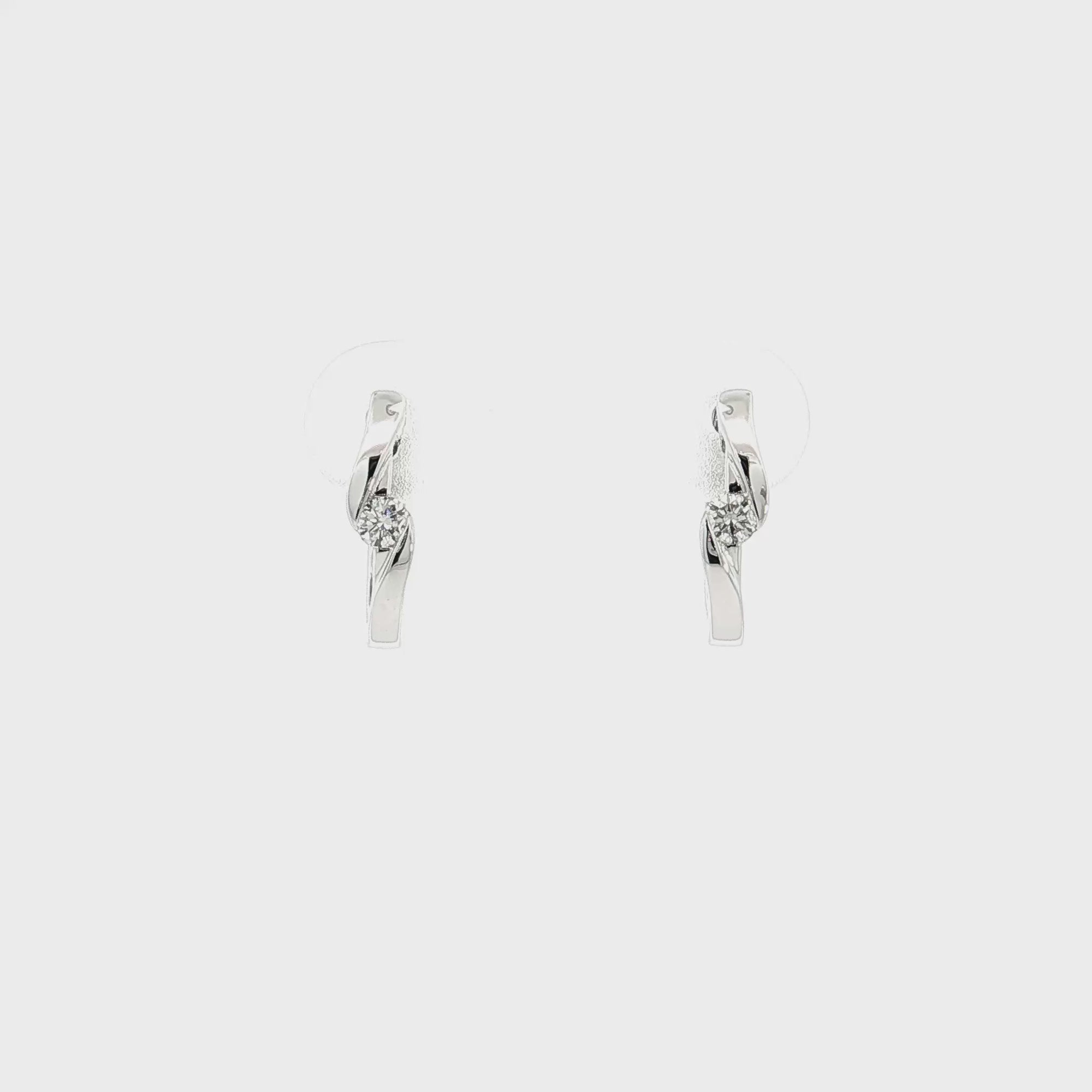 14K White Gold 0.13cttw. Diamond Twist Huggie Earrings